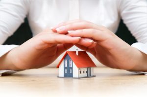 House,Covered,Of,Woman,Hands,-,Insurance,Real,Estate,Concept